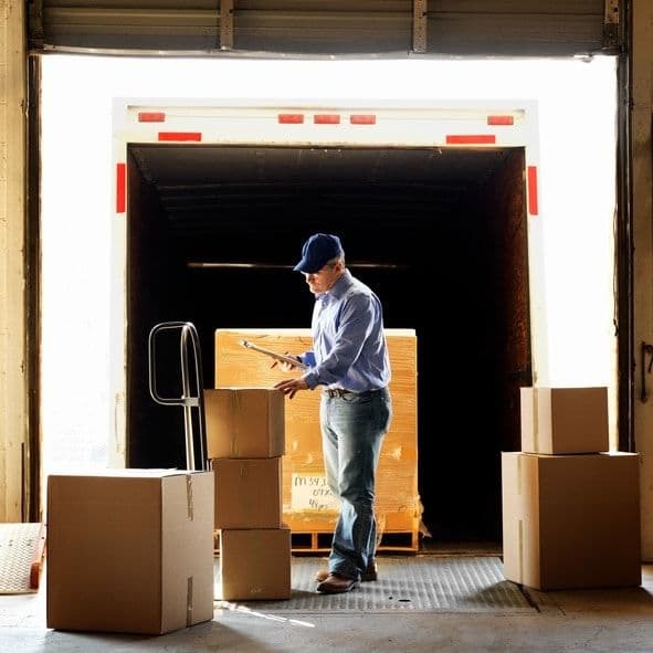 Worker loading packages in a truck