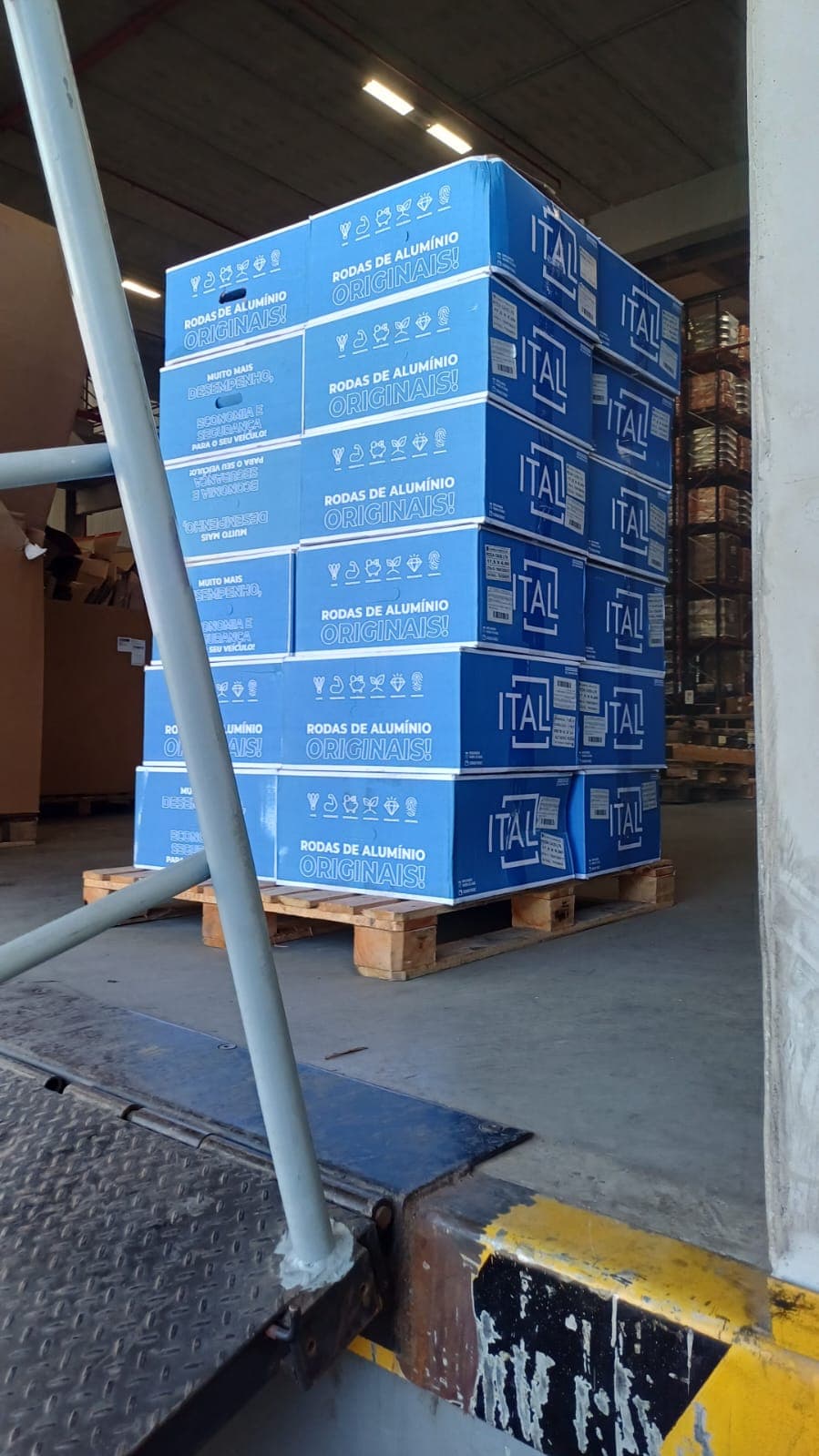 Stacked blue shipping boxes on pallet